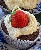 Chocolate cupcake with strawberry and cream